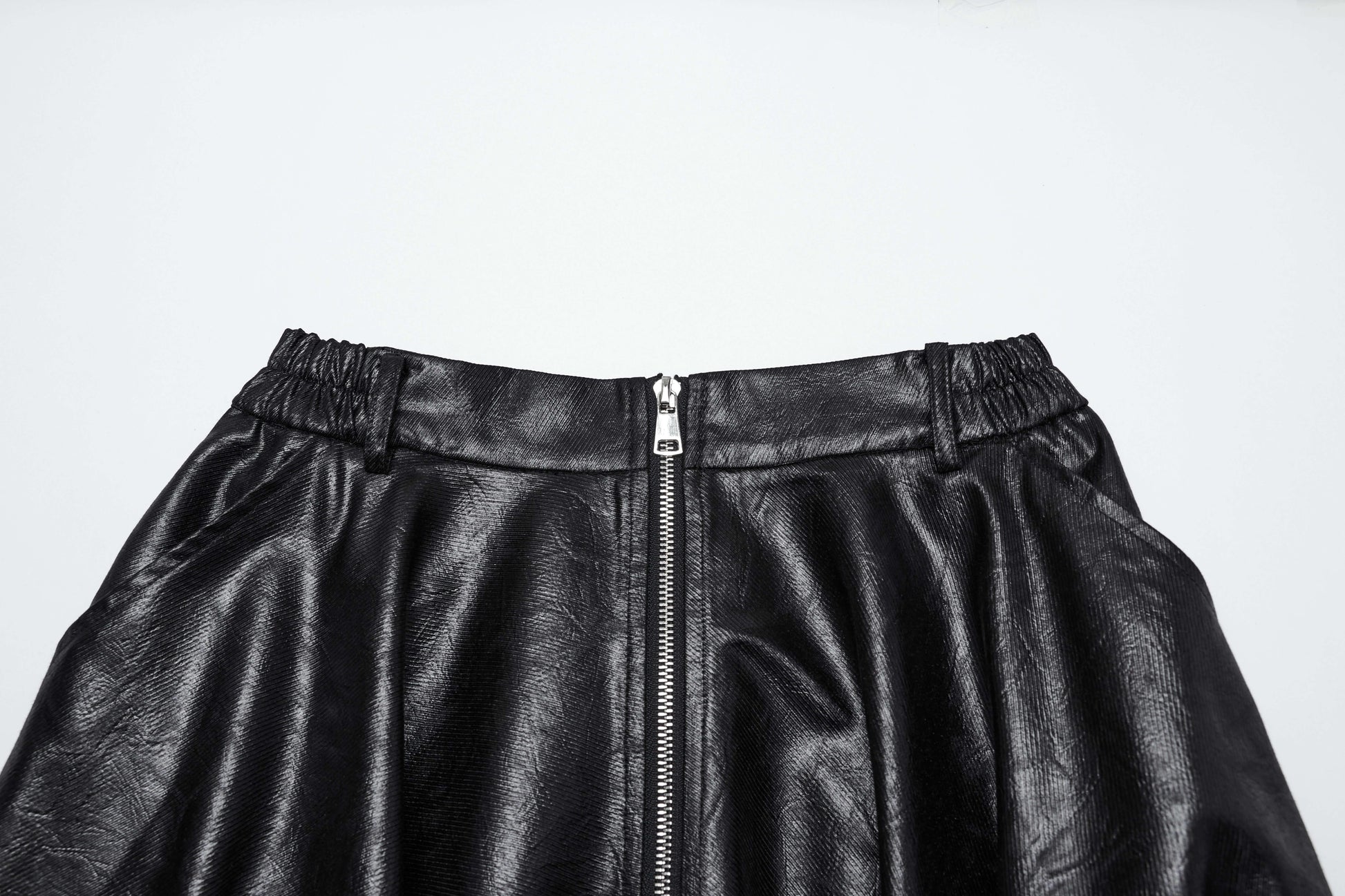 Model wearing the Punk Rave Myra wrinkled faux leather skirt, demonstrating its elegant silhouette and fashionable appeal.