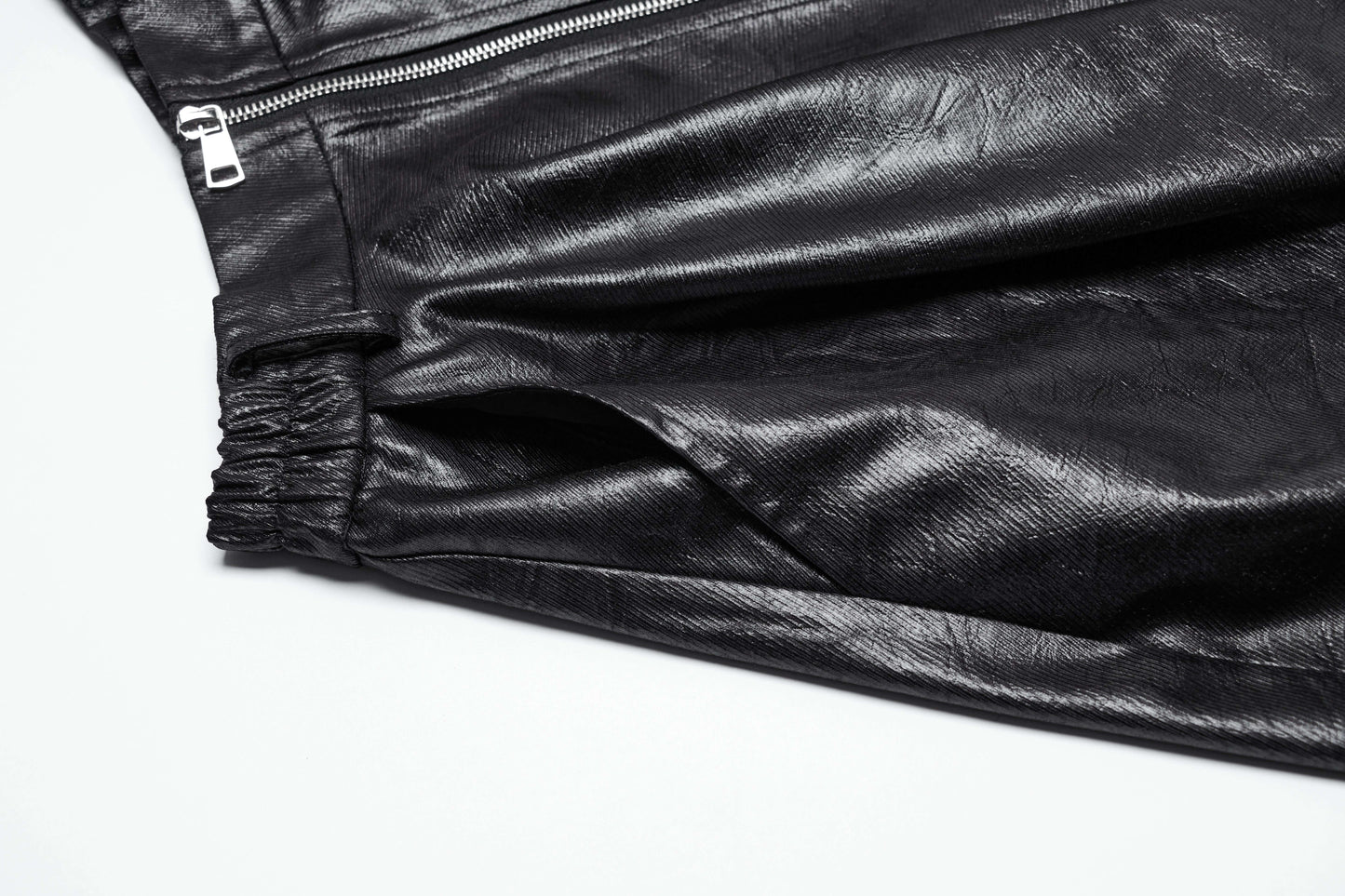 Detail image of the Punk Rave Myra skirt focusing on the irregular hemline and luxurious faux leather texture.