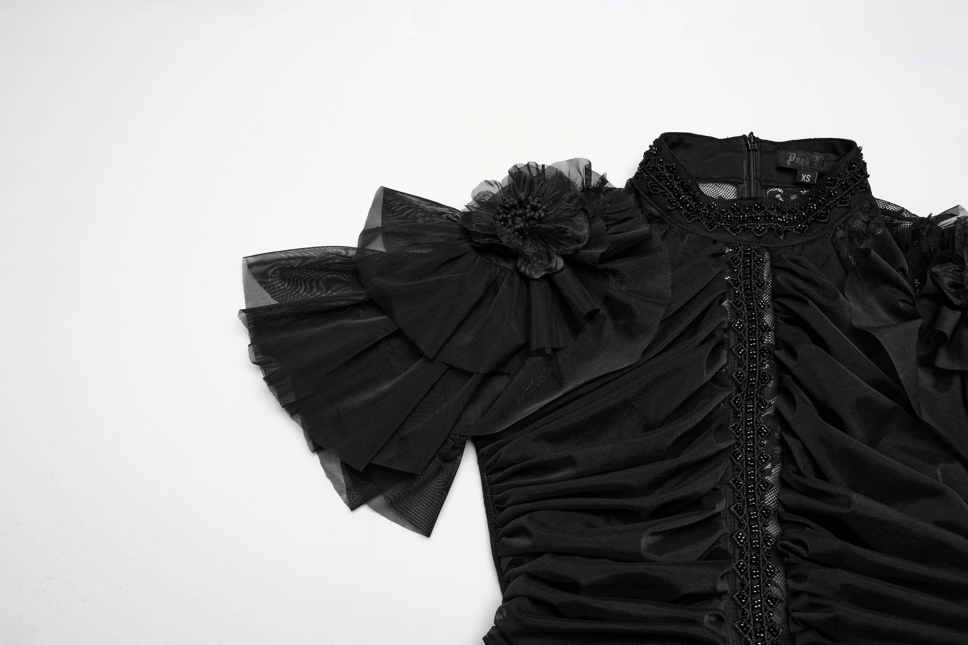 Close-up view of the Punk Rave Nova Gothic dress highlighting the exquisite bead embroidery and ruffled shoulder trim, perfect for an elegant yet rebellious look.