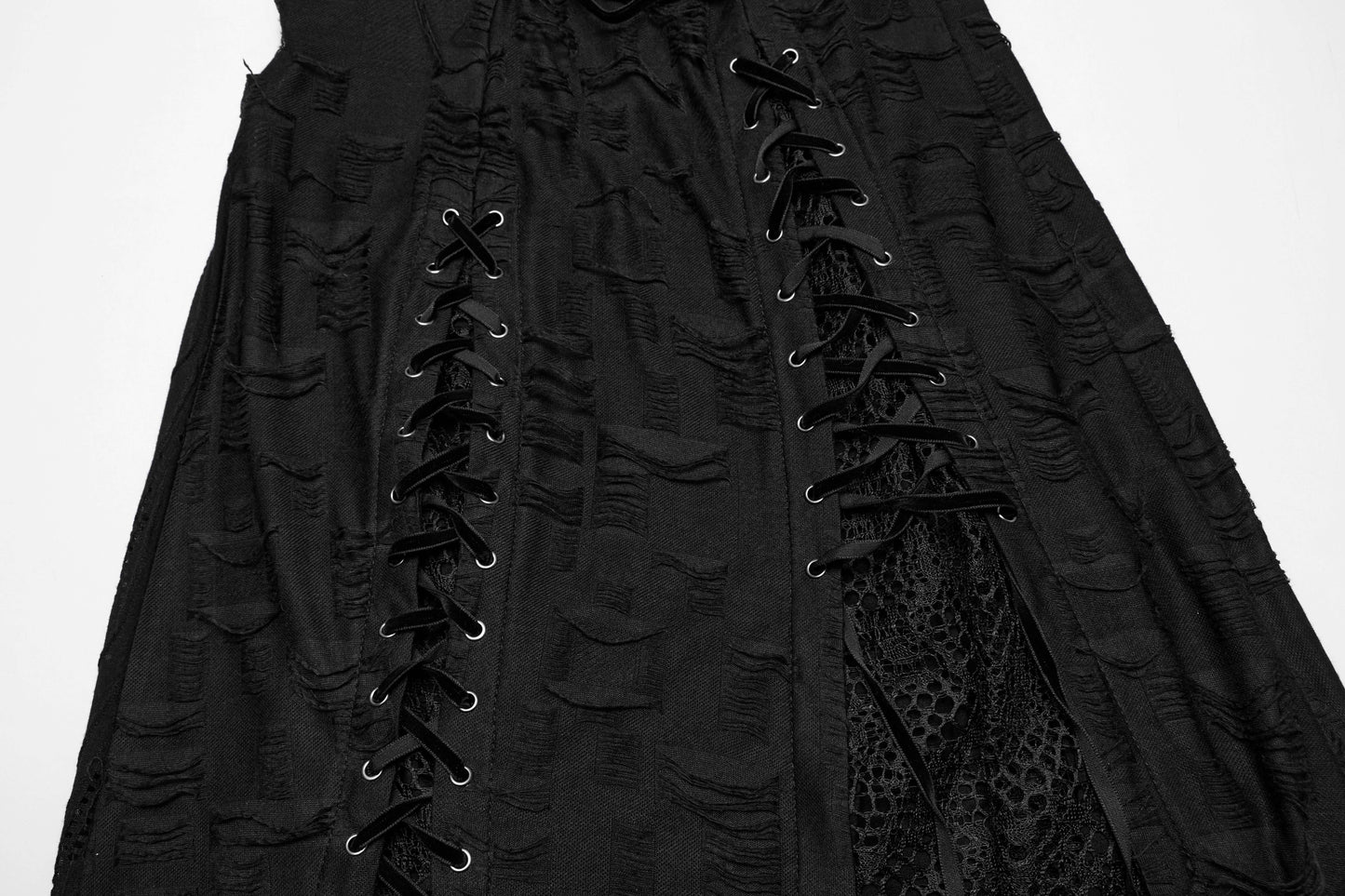 Close-up of the tattered knit fabric and lace details on the Punk Rave Asymmetric Honey Dress, emphasising the luxurious craftsmanship and edgy appeal.