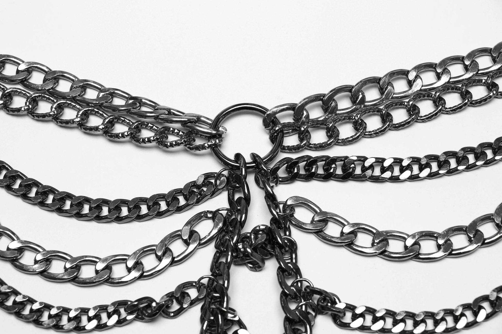 Punk Rave Anslie Aluminium Chain Dress displayed artistically, illustrating its dual function as a one-piece or two-piece outfit for versatile styling.