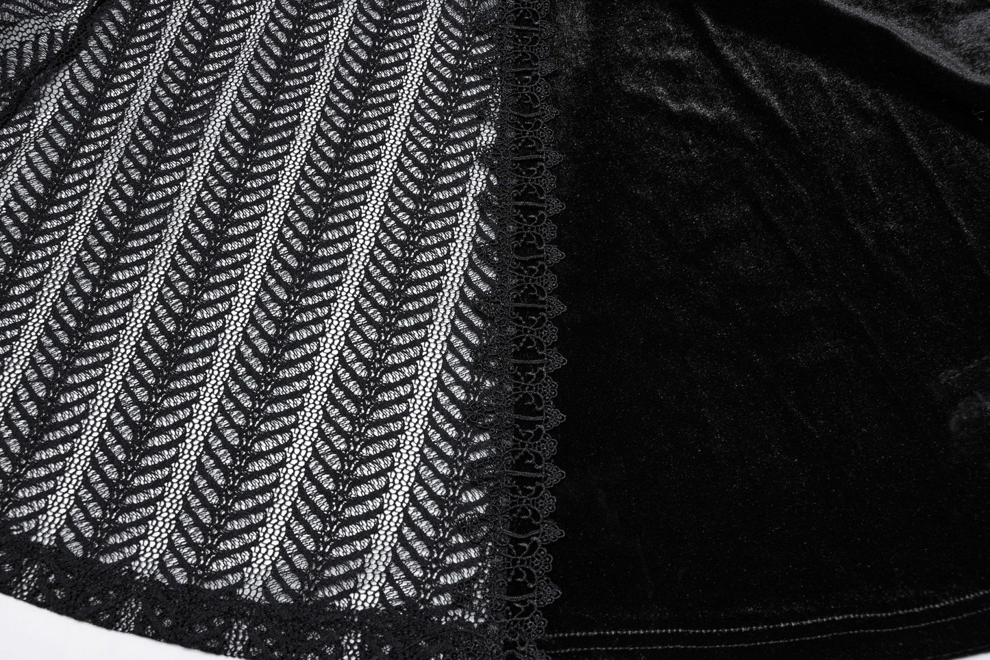 Flat lay of the Punk Rave Nera Goth Dynamic Skirt, emphasizing its luxurious fabric blend of velvet and lace, ideal for layering in winter outfits.