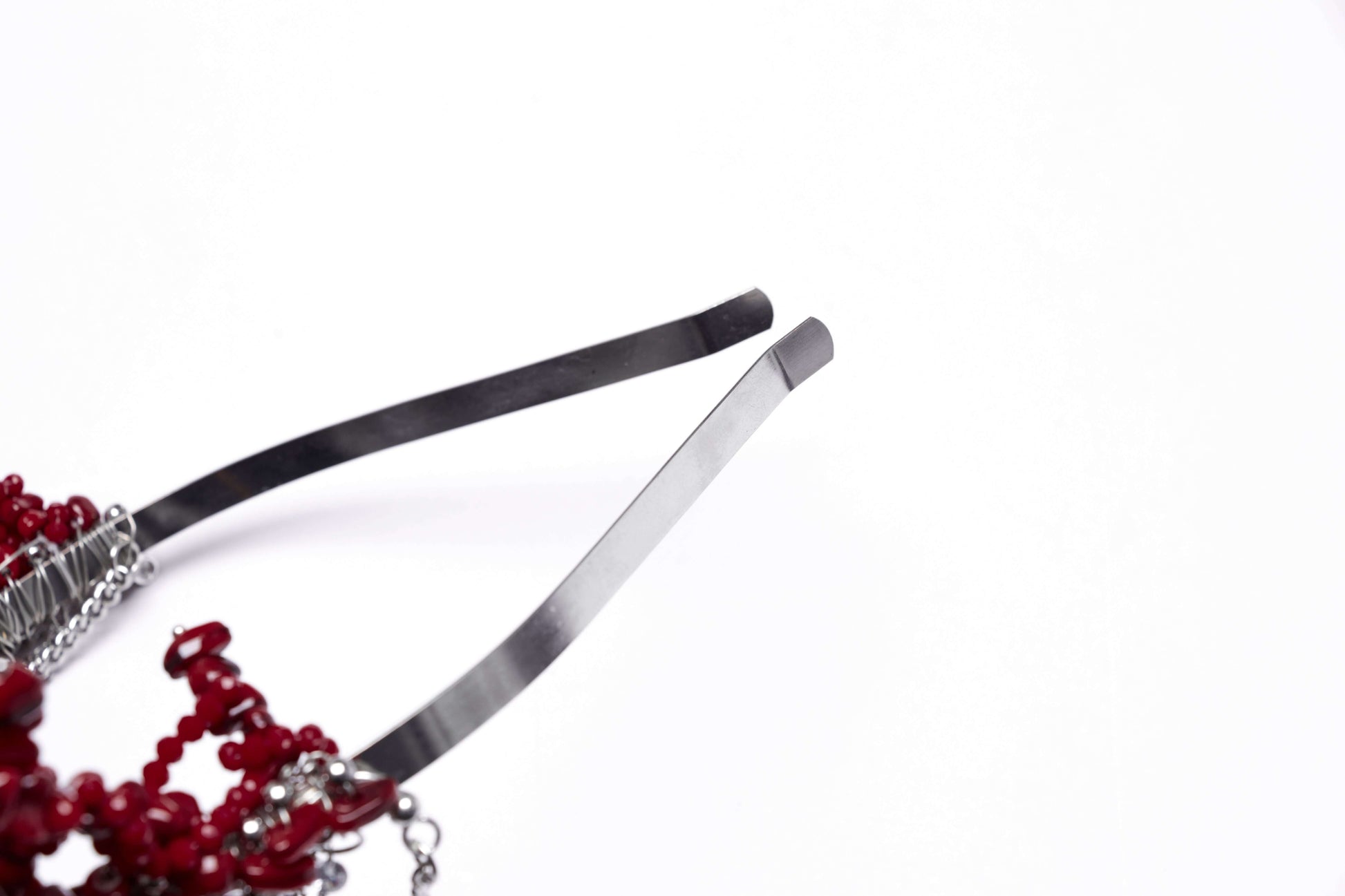 Close-up of the handcrafted Punk Rave Effie Headband featuring stunning irregular red stones and intricate detailing, epitomising punk elegance.