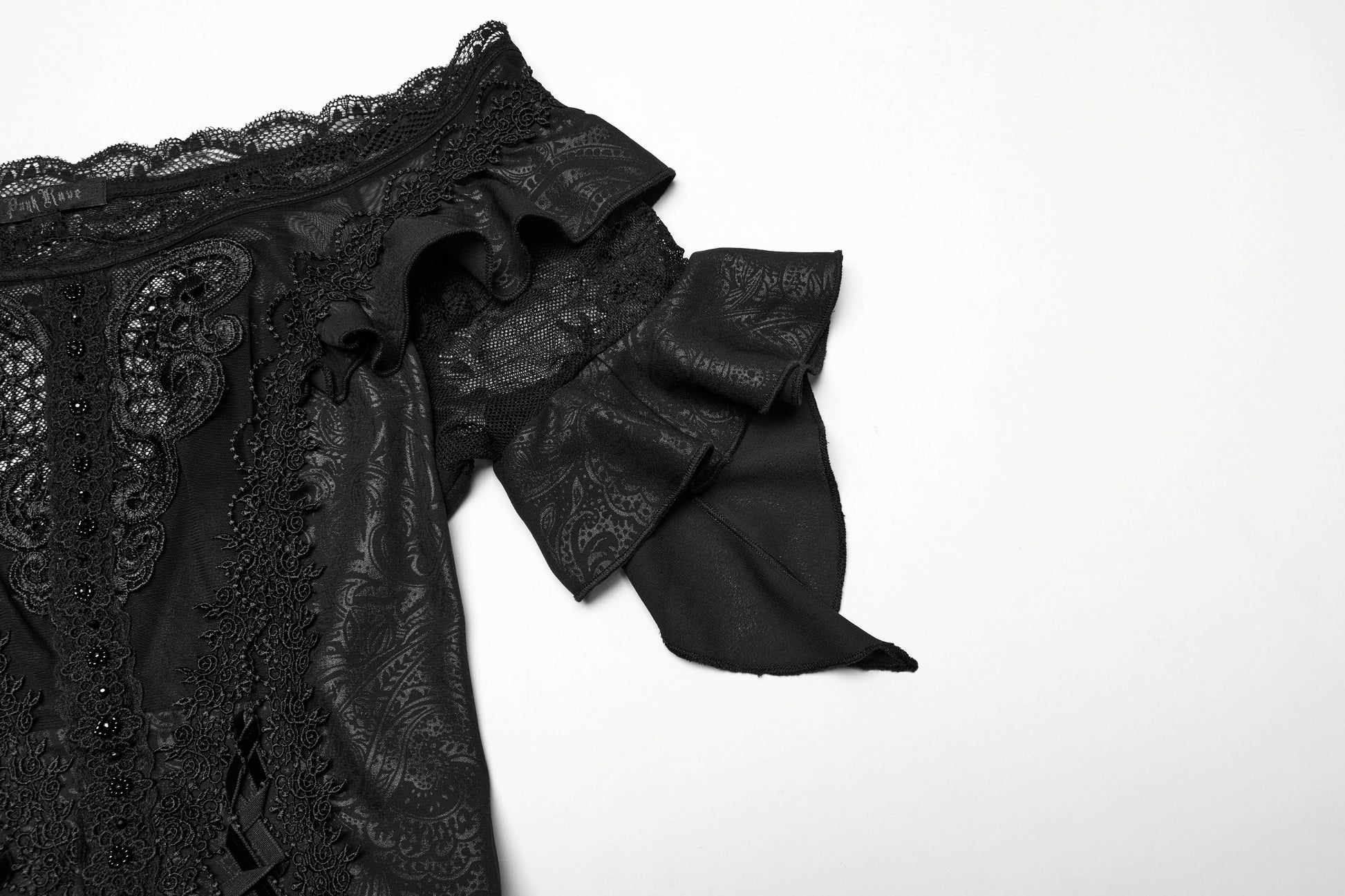 Model wearing the striking Punk Rave Jezebel Elf Dress with high-low hemline, presenting a spellbinding silhouette that blends elegance and edginess.