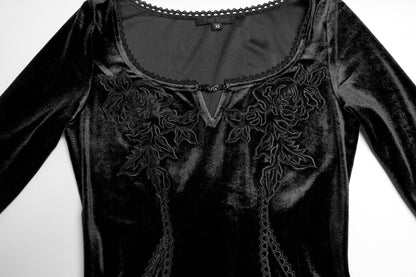 Full-length view of the Isolde black velvet dress, exemplifying luxurious gothic elegance with its flowing skirt and structured fit.