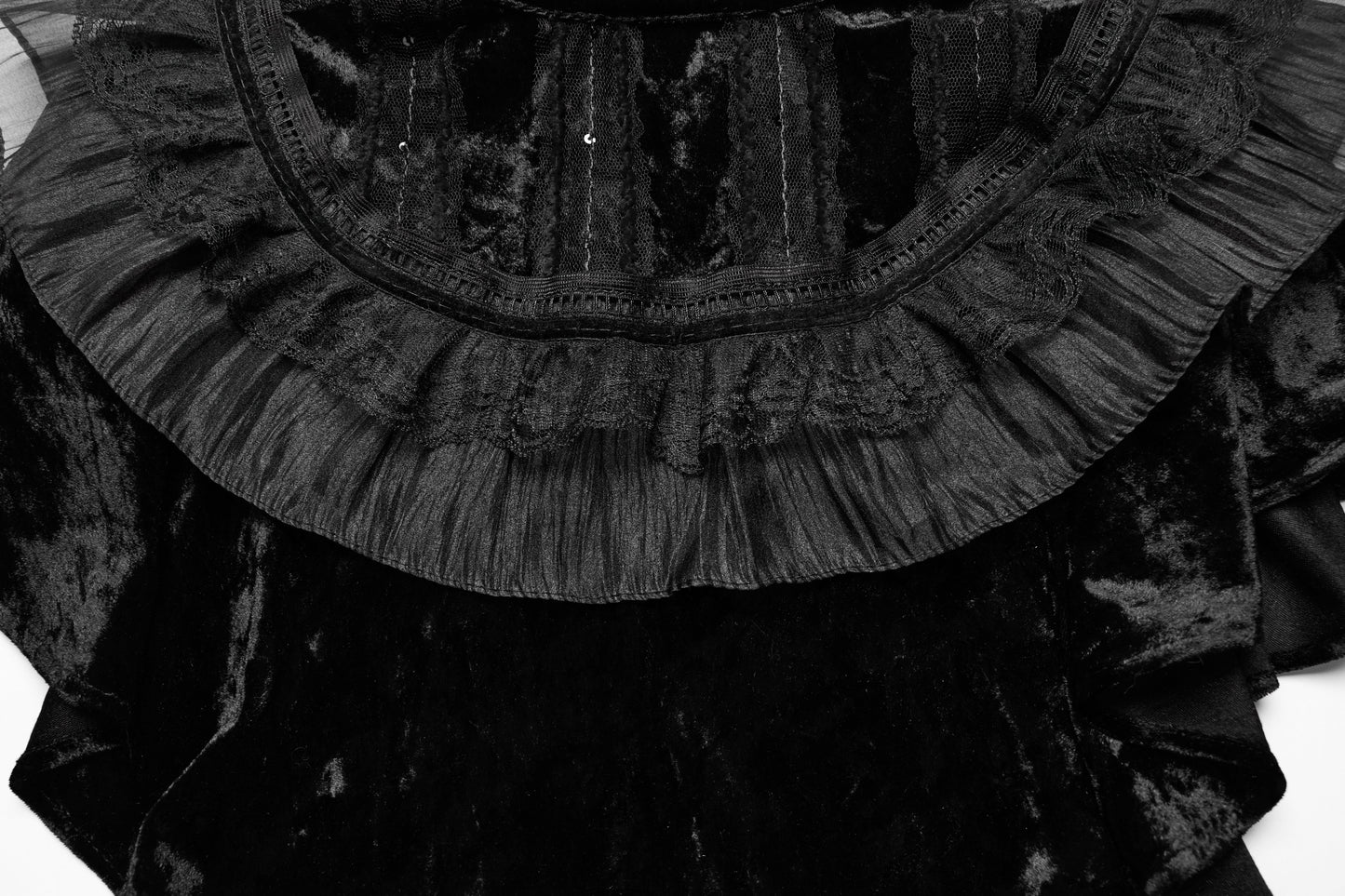 Sophisticated styling of the black velvet ruffle shawl designed for gothic and steampunk aesthetics.