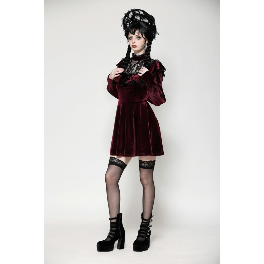 Stylish burgundy velvet dress with gently belled sleeves and a flared skirt, ideal for upscale occasions and special events.