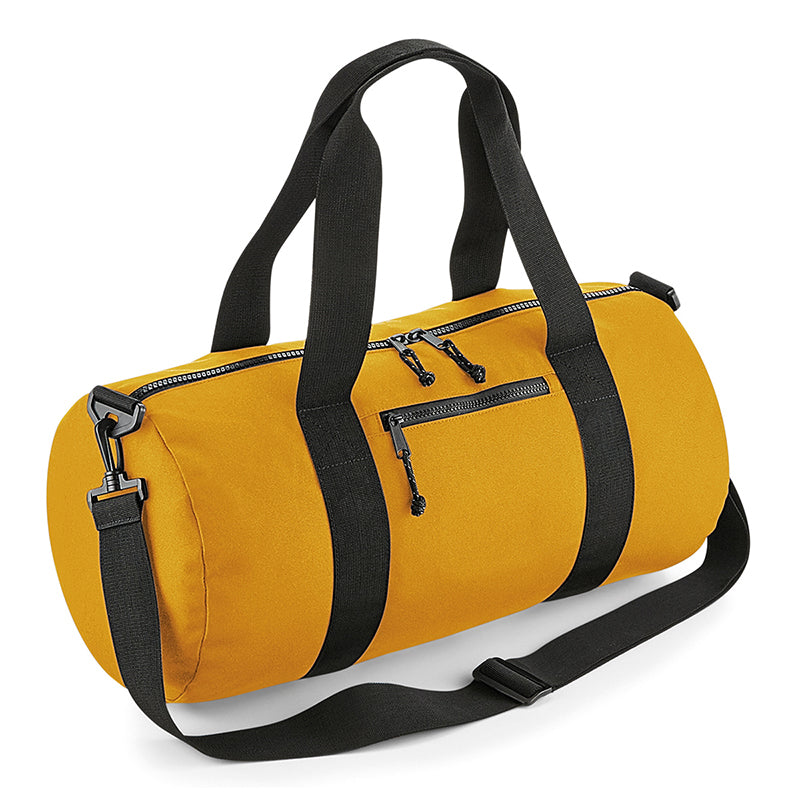 Eco-friendly 20L recessed barrel bag featuring luxurious adjustable shoulder strap and stylish reflective zip pulls, perfect for sustainability-conscious consumers.