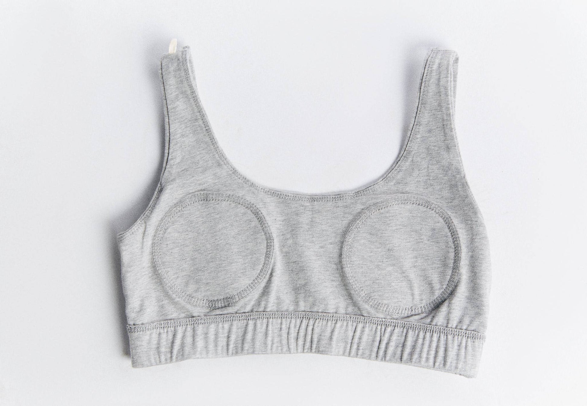 Elegant and supportive organic cotton bralette with broad straps, designed for all-day wear and conscious living.