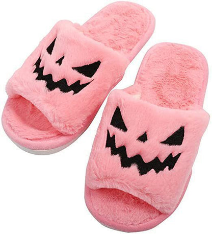 Halloween Shoes Winter Cute Warm Home Slippers for Women - Pink plush slippers with a pumpkin face design, perfect for cosy indoor wear during the festive season.