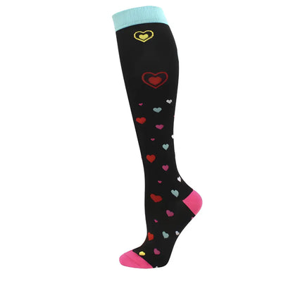 Women's Knee Length Compression Travel Socks featuring a playful heart pattern, perfect for comfort, style, and enhanced circulation during travel.