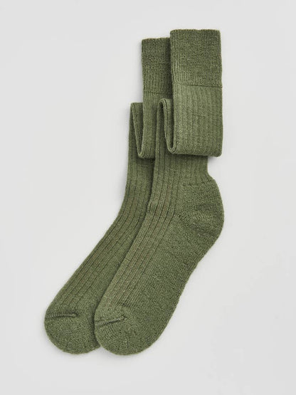 Luxurious wool knee high socks featuring a cushioned sole for optimal warmth and comfort, crafted in Portugal.