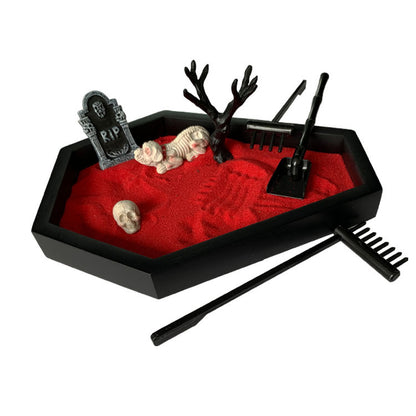 Luxurious Halloween Sand Table Decoration Micro Landscape Sandbox Crafts showcasing a captivating red sand layout with spooky elements including a skull, skeleton, and gardening tools.