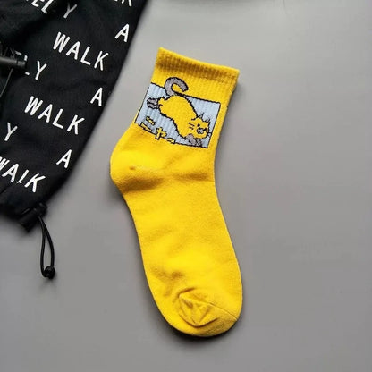 Charming yellow Stylish Hip Hop Long Socks for Women & Girls showcasing a delightful cartoon cat design. Made of a rich cotton-polyester blend for comfort and durability.
