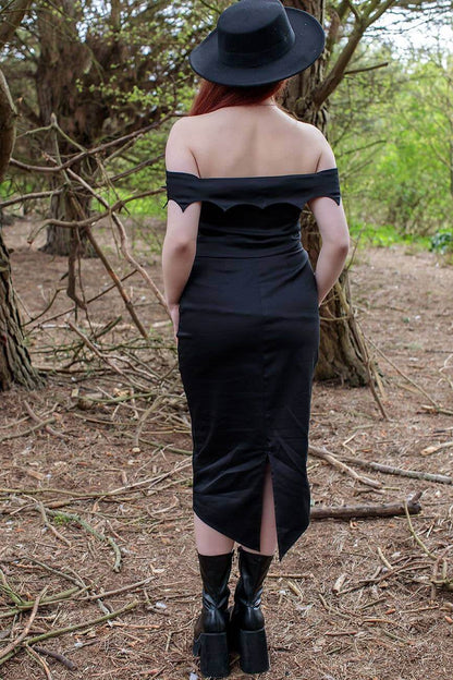 Model showcasing Gothic Glam Organic Cotton Sateen Off-Shoulder Midi Dress, embodying high-fashion with a unique goth-inspired design.