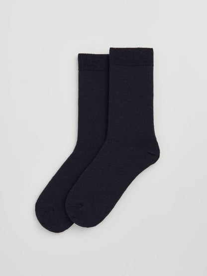 Luxurious Merino Wool calf-length socks in a stylish display, featuring smooth texture and odour-resistant properties, perfect for everyday comfort.