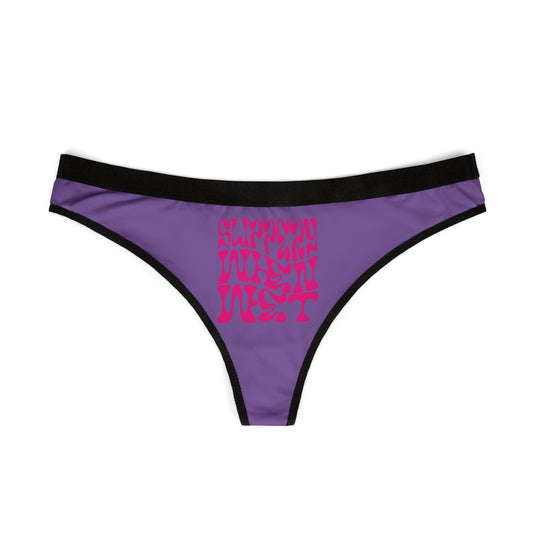 Luxurious purple thong panties featuring the playful text 'SLIPPERY WHEN WET' in bold pink print, designed for ultimate comfort and style.