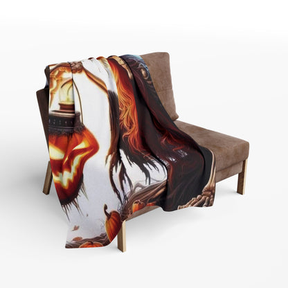 Luxurious Decorative and Warm Halloween Spooky Arctic Fleece Blanket draped elegantly over a stylish sofa, featuring intricate Halloween-themed designs including jack-o'-lanterns and black cats.
