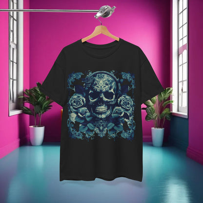Elegant Skulls and Roses Cotton Tee displayed against a vibrant pink backdrop, showcasing its intricate graphic design and unisex appeal.