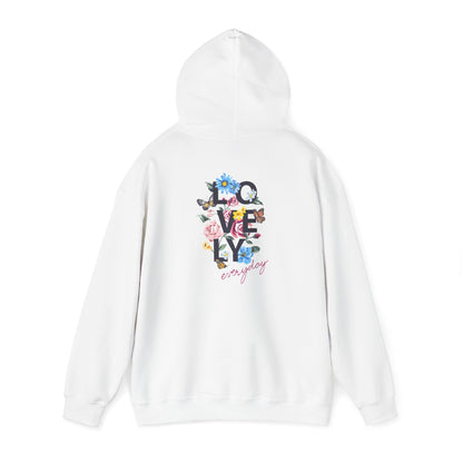 Stylish white hoodie featuring a vibrant floral graphic on the back with the text 'LOVELY everyday' in chic typography, ideal for fashion-forward individuals.