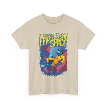 Luxurious beige men's t-shirt featuring a vibrant cosmic graphic design with the phrase 'I NEED SOME SPACE', showcasing an astronaut in a stylish armchair, perfect for casual elegance.
