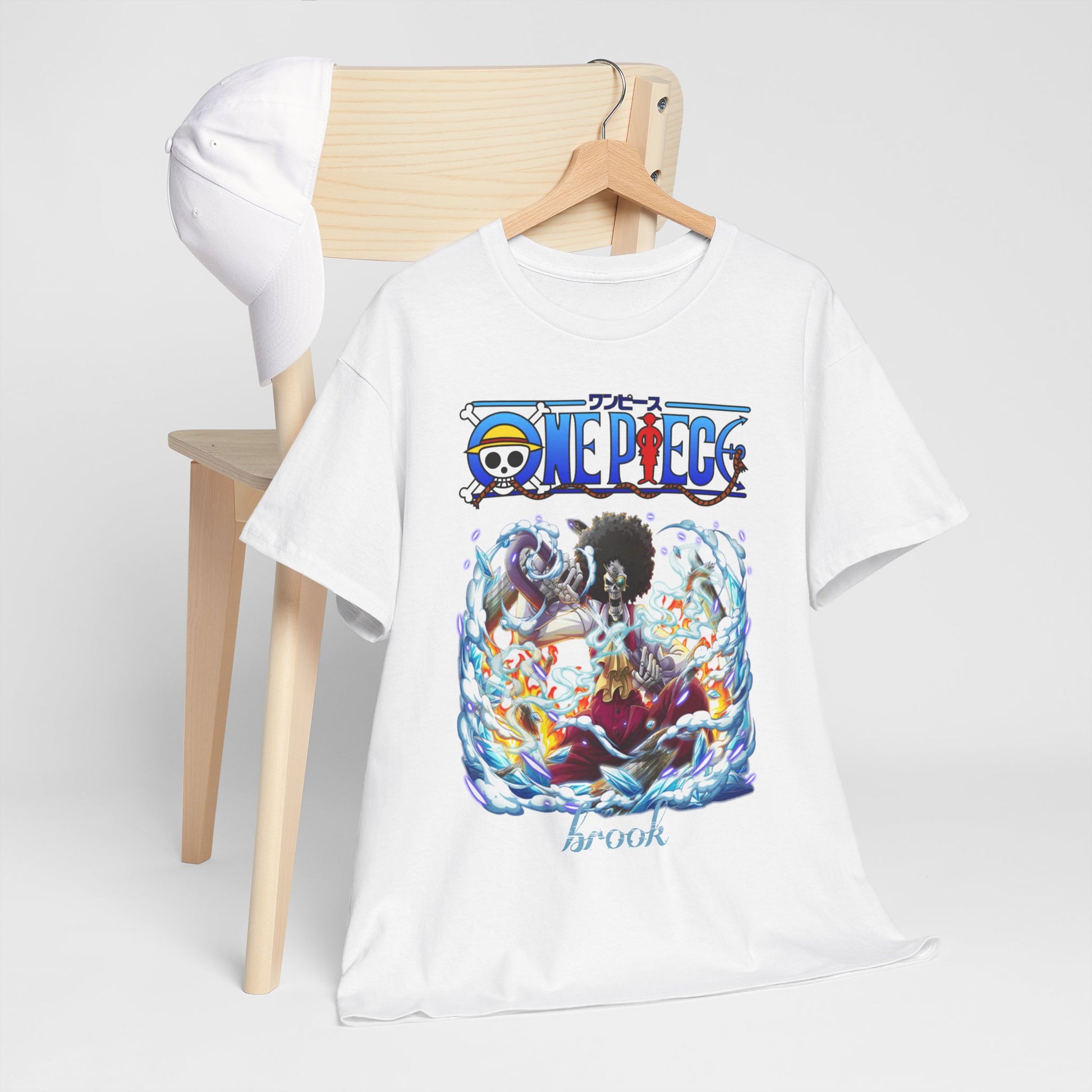 Elegant presentation of a white t-shirt featuring Brook from One Piece, displayed on a wooden hanger near a chic chair, showcasing bold anime artistry.