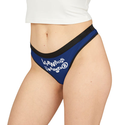Elegant woman showcasing the International Star Thong in a vibrant blue colour, featuring a playful graphic design, perfect for adding a luxury touch to intimate apparel.