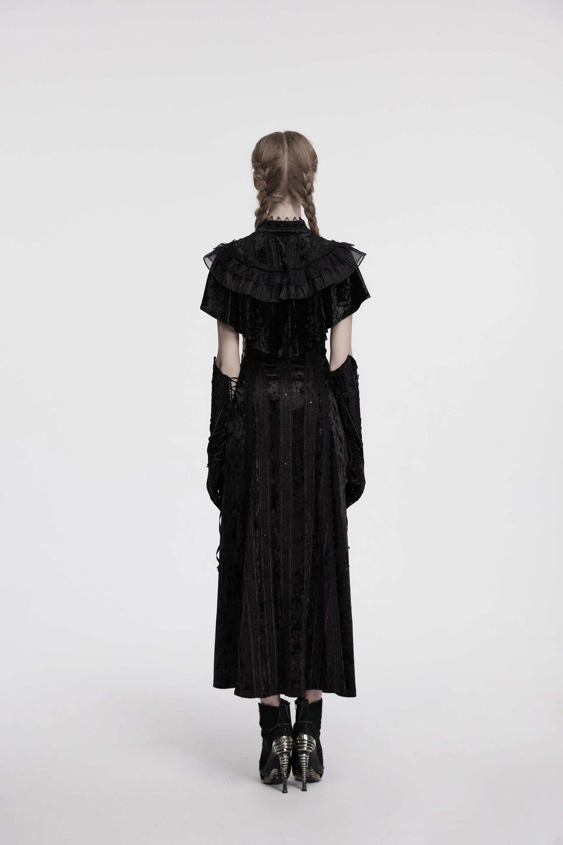 Full view of the Punk Rave Elysia black velvet shawl draped over a dress, showcasing its romantic silhouette and vintage rose buckle closure.