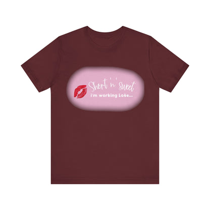 Sabrina Carpenter Inspired Unisex Short Sleeve Tee in a deep maroon hue with a bold lipstick print, a luxurious piece designed for fashion-forward individuals.