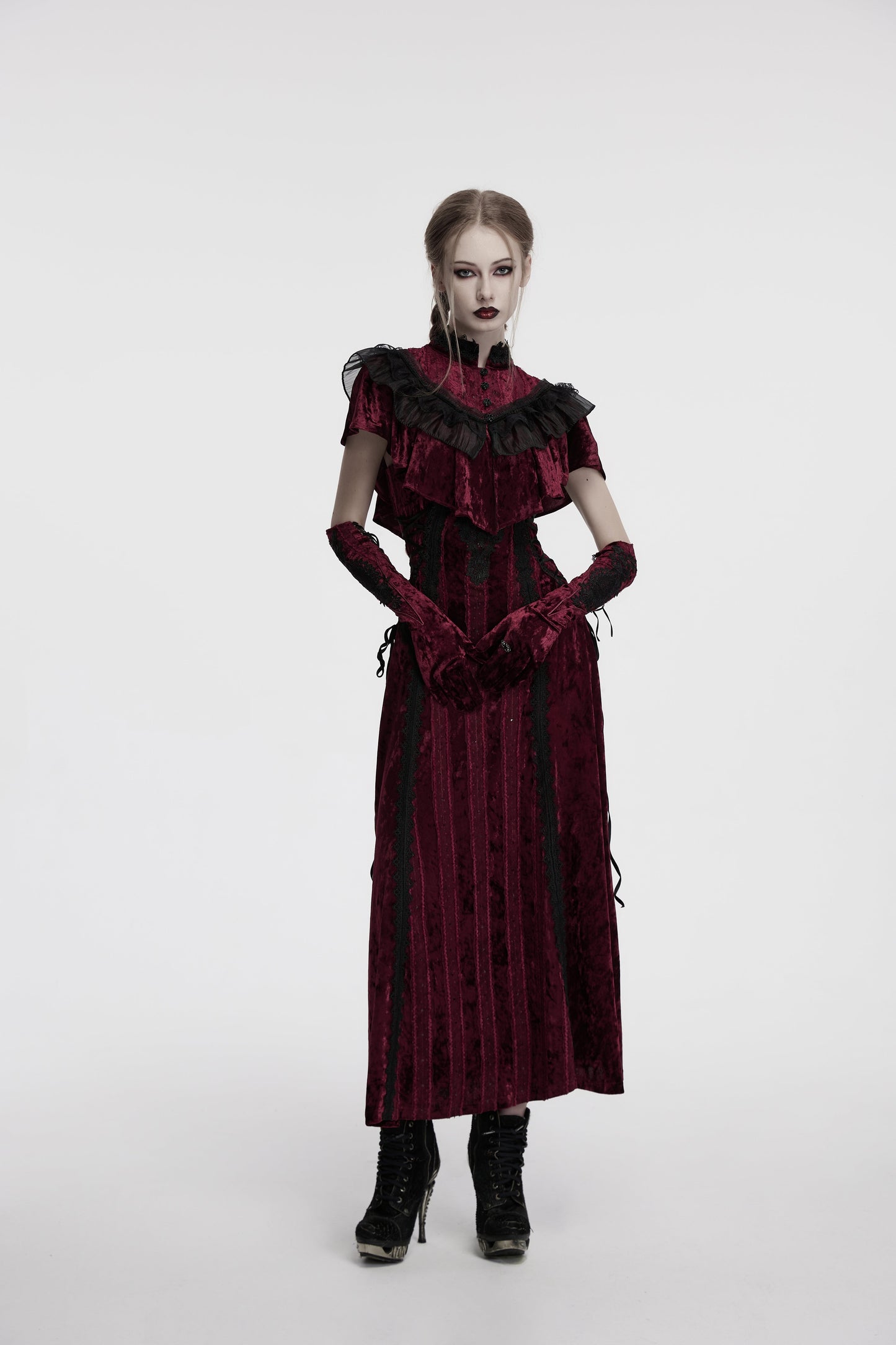 Stylish image of crimson gloves with vintage rattan-inspired detailing, emphasizing the luxurious fabric and gothic aesthetics.