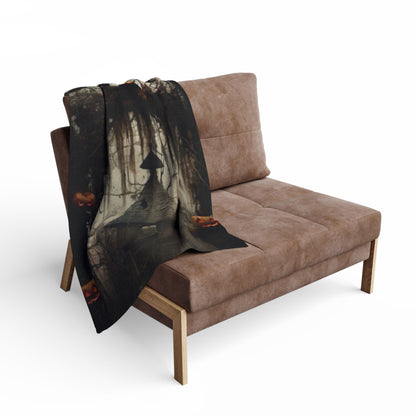 Decorative and Warm Halloween Spooky Arctic Fleece Blanket draped over a stylish chair, presenting a captivating Halloween atmosphere with jack-o'-lanterns and a dark mysterious backdrop.