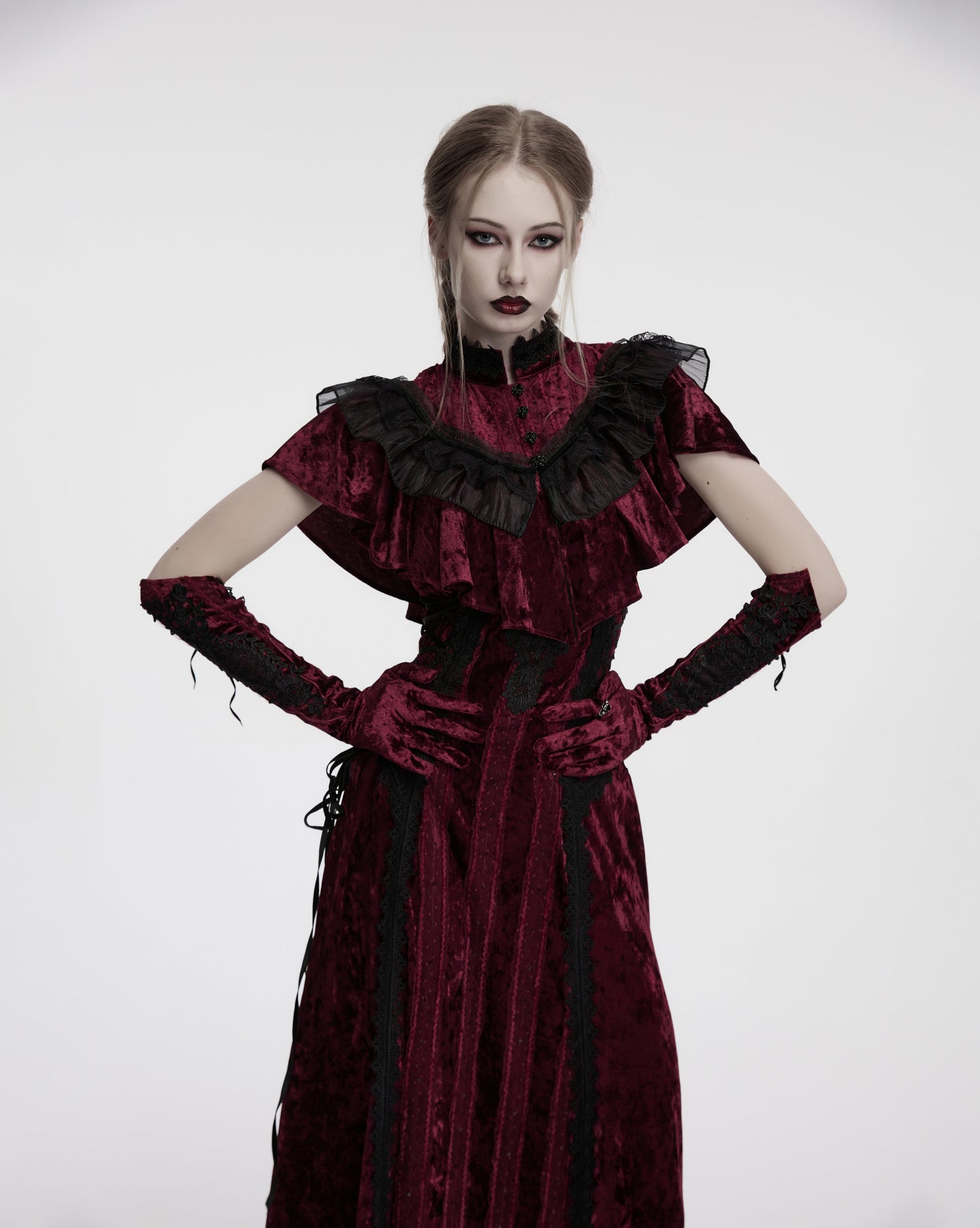 Luxurious crimson velvet gloves adorned with intricate black embroidery and elegant pointed cuffs, ideal for gothic and alternative fashion.