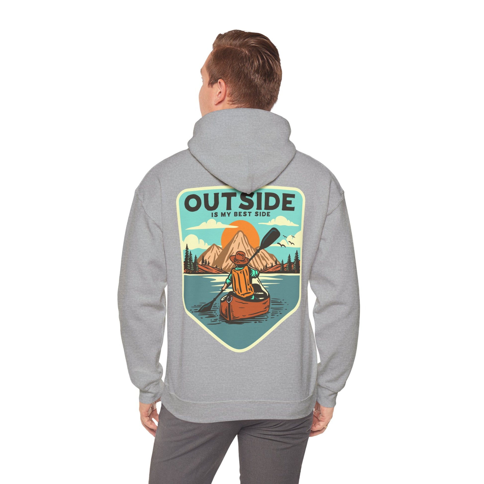 Elevate your outdoor style with this luxurious retro hoodie featuring a stunning kayaker design against a serene mountain and sunrise backdrop, showcasing the inspirational phrase 'OUTSIDE IS MY BEST SIDE'.