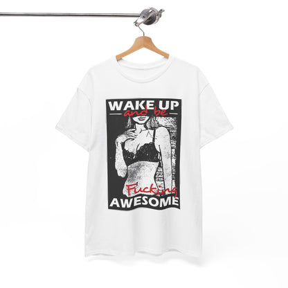 Elegant white graphic tee hanging on a wooden hanger, showcasing a striking design with 'WAKE UP and be' alongside 'Fucking AWESOME', embodying contemporary fashion flair.