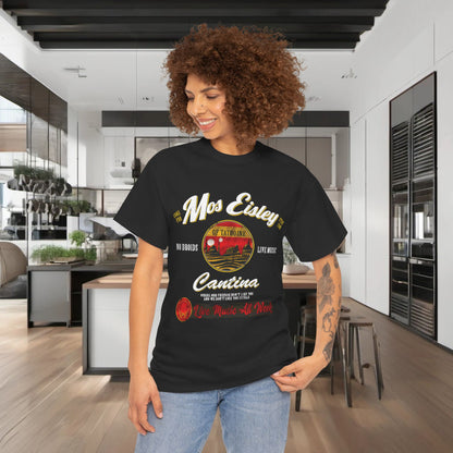 Luxury urban unisex Star Wars Mos Eisley Cantina Graphic T-Shirt worn by a model with curly hair, featuring vibrant graphics in a contemporary kitchen setting.