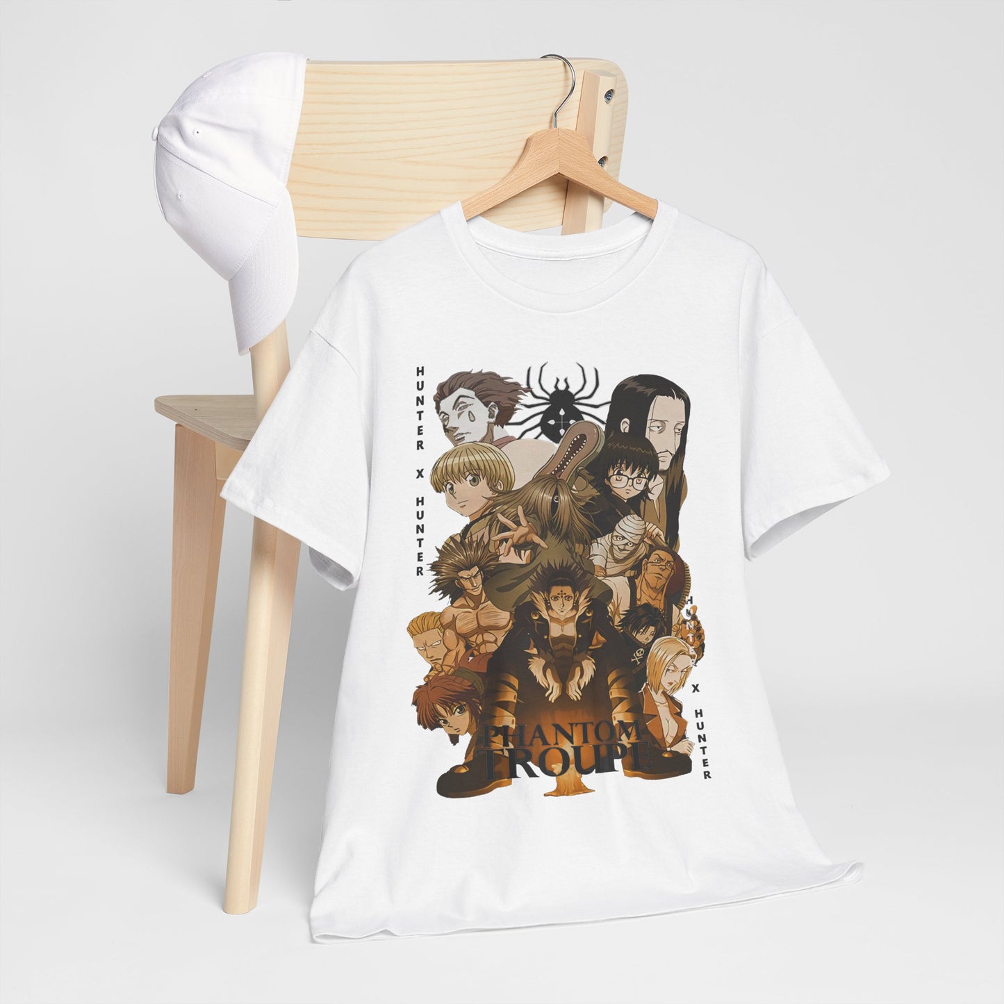 Elegantly displayed white Phantom Troupe T-shirt from Hunter x Hunter, artfully arranged on a minimalist wooden chair, enhancing the design's allure.