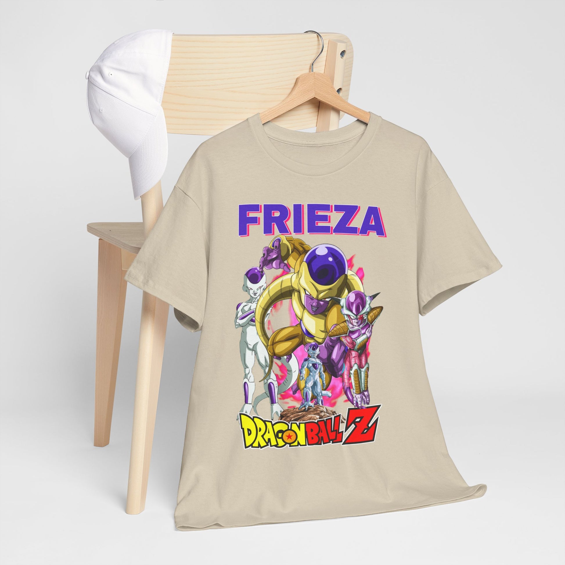 Chic Dragon Ball Z T-shirt featuring Frieza, styled on a wooden chair alongside a white cap, presenting a fashionable ensemble for casual outings.