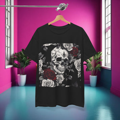 Skulls and Roses Cotton Tee, Unisex Graphic Shirt displayed on a hanger in a vibrant room with a pink background, showcasing its striking steampunk design featuring skulls and roses.