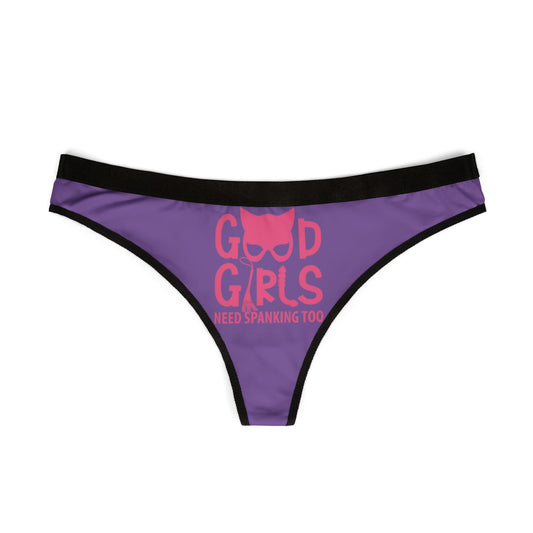 Front view of a luxurious purple women's thong with bold graphic design stating 'Good Girls Need Spanking Too'. Ideal for playful gifting and intimate surprise.