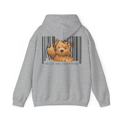 Chic grey hoodie displaying a playful teddy bear caught in a contemporary barcode. The soft, warm hues of the bear enhance the creative aesthetic, while the text 'HELLO ARE YOU THERE' engages the viewer.