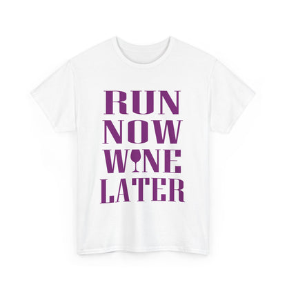 Stylish white women's t-shirt showcasing the motivational quote 'RUN NOW WINE LATER' in bold purple letters with a wine glass graphic, ideal for fitness enthusiasts.