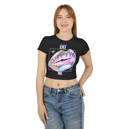 Chic model showcasing the Cheeky Women's Cropped T-Shirt featuring a striking 'Eat Me' iridescent lips graphic in black organic cotton.