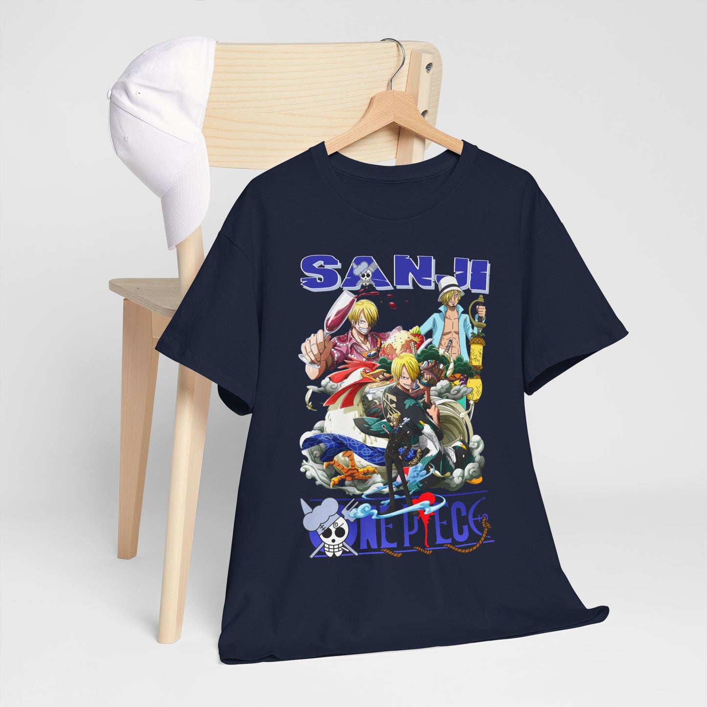 Luxury navy blue men's t-shirt featuring a vibrant graphic design inspired by the character Sanji from the anime One Piece, elegantly displayed on a wooden hanger next to a stylish white cap.