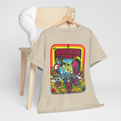 Chic arrangement of a Stranger Things graphic t-shirt draped on a wooden chair, complemented by a cap, reflecting a trendy and nostalgic style.