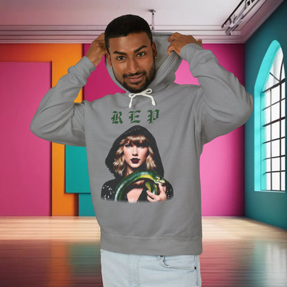 Model wearing a premium unisex cotton hoodie for Swifties, showcasing a unique Taylor Swift design with a vibrant green snake, perfect for fans.