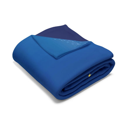 Decorative and Warm Christmas Arctic Fleece Blanket in a striking blue colour, folded neatly to highlight its soft, luxurious feel, ideal for festive gatherings.