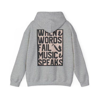 Elegant grey hoodie featuring a striking back print with the phrase 'WHEN WORDS FAIL MUSIC SPEAKS' and artistic saxophone illustrations, ideal for sophisticated casual wear.