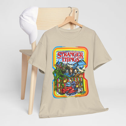 Elegant Stranger Things graphic t-shirt draped over a chair next to a white cap, showcasing a playful yet stylish design that reflects the enchanting world of the series.