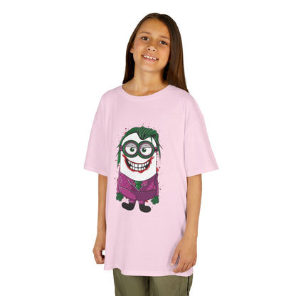 A young girl smiling while wearing a pink Minions Joker T-Shirt, which combines the playful Minion character with the Joker persona from The Dark Knight Rises, making it a fun and creative outfit for kids. This is a charming Funny Minions T Shirt.
