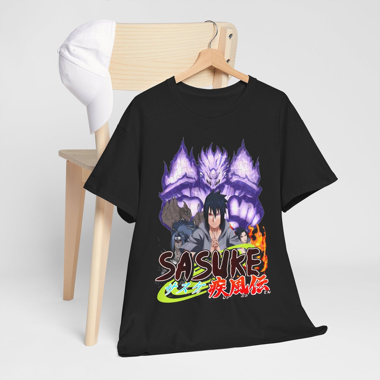Sophisticated styled image of a black Sasuke graphic tee on a minimalist chair next to a matching cap, highlighting its unique anime-inspired artistry.